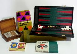 A green gaming cloth, a backgammon board