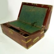 A mahogany writing slope with brass carr