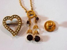 Gold-coloured metal and almandine garnet