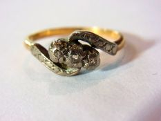 18ct gold and three-stone diamond cross-