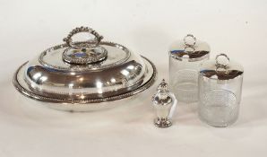 An oval entree dish and cover with bead