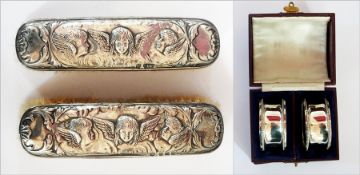 A pair of Edwardian silver napkin rings