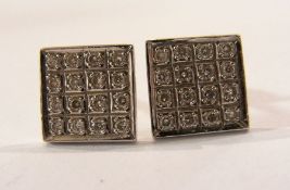 Pair of white metal and diamond earrings