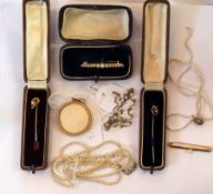 Two gold-coloured metal and pearl stick