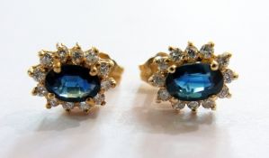 Pair 14K blue stone and diamond cluster