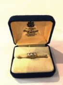 18ct gold three-stone diamond ring, 0.7c