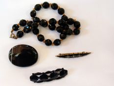 Black onyx oval brooch, black enamel and