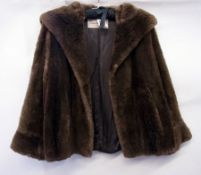 A vintage squirrel fur stole and a lamb