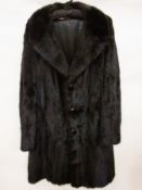 A gentleman's three-quarter length black