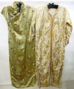 A gold-coloured satin cheong sang, full