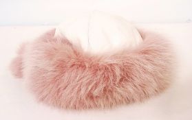 A mink cap with suede bow, with a leathe