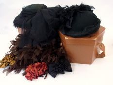 A black straw hat heavily trimmed with b