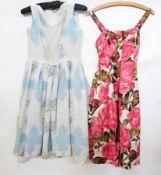 A 1950's cocktail dress printed with lar