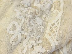 A pair of net coverlets appliqued with b