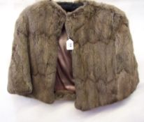 A chinchilla shoulder cape and a musquas