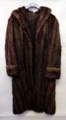 A lady's musquash fur coat and a pastel