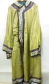 A Chinese yellow silk robe, the sleeves