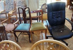 Black swivel office chair and three vari