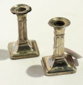 A pair of dwarf silver candlesticks, ind