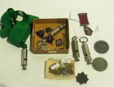 Quantity of various whistles including S