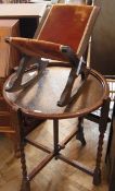 An oak circular top folding tea table, o