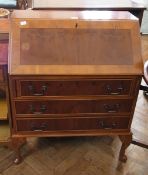 A reproduction yew wood veneer bureau, w