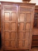 Reproduction antique oak panelled wardro