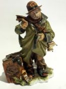 Capodimonte figure of a gentleman sittin