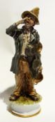 Capodimonte style figure of a tramp sitt