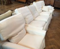 Cream covered feather cushioned three-pi