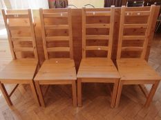 A modern pine rectangular top dining tab