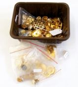 A collection of military buttons and oth