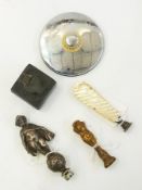 Plated cherub-pattern car mascot in the