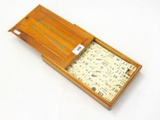 A lacquered Mahjong box rests and boxed