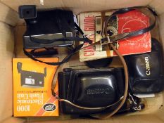 Two Canon cameras, Polaroid land camera