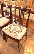 A mahogany dining chair with upholstered seat,
