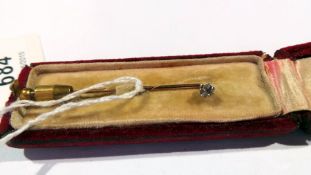 Gold-coloured metal and diamond stickpin