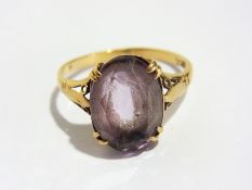 Three single set amethyst rings and a 9ct gold amethyst ring set three stones