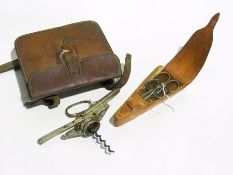 A white metal lunch box in leather holst