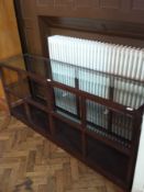 An Indonesian hardwood shelving unit wit