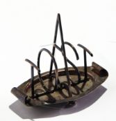 A silver stylistic four-division toast rack, the dividers spelling 