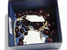 18ct gold and diamond ring set four small diamonds with crossover mount and quantity of amber beads