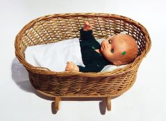 Sebino Italian vinyl baby boy doll in wicker cradle