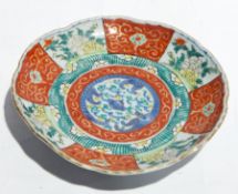 Three famille verte pottery plates, 21 cms diam.