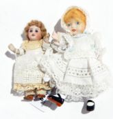 French bisque porcelain doll's house doll with blue paperweight-style eyes and a Lillian Middleton