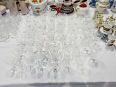 A suite of 20th century cut and etched wines, trellis and scroll design including liqueurs,