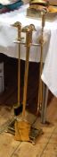 A brass fire side companion set with duck headed handle