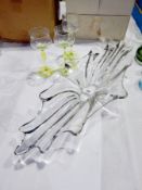 Three green and clear moulded wine glasses having slightly waisted bowls, on baluster green stems,