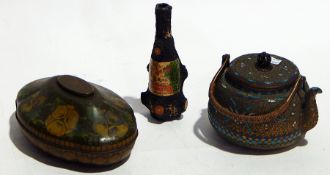 A floral tin decorated jug, a hardwood carved newspaper holder,