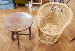 A late 19th century oval top Sutherland table on turned supports together with a cane conservatory